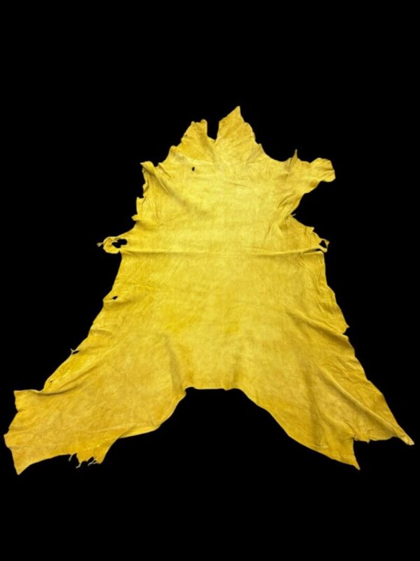 KBOM6110 Yellow animal hide on a black background.