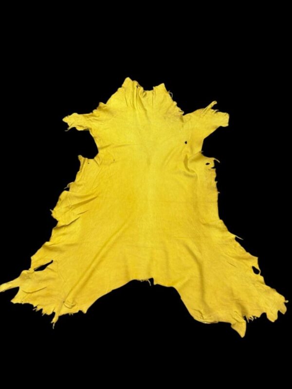 Yellow fabric laid out on a black background.