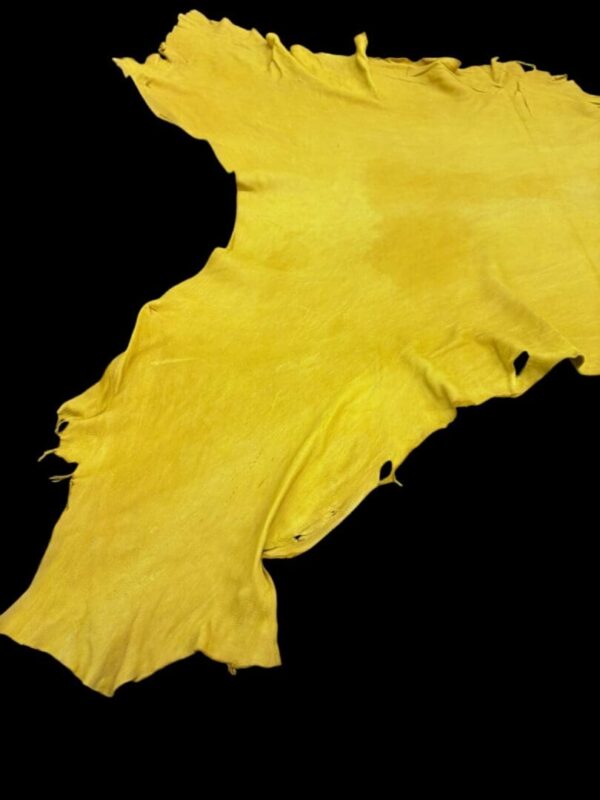 TVGQ3002 Yellow leather piece on a black background.