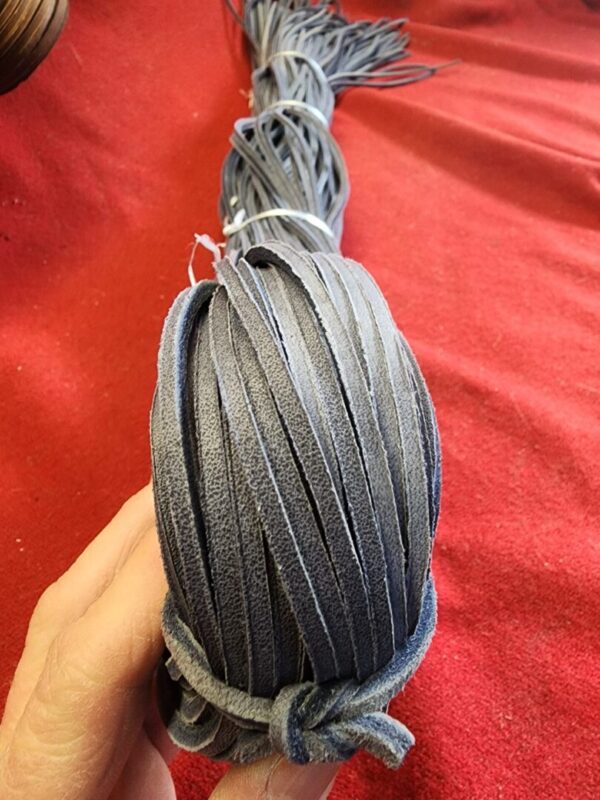Gray leather strips in a bundle.