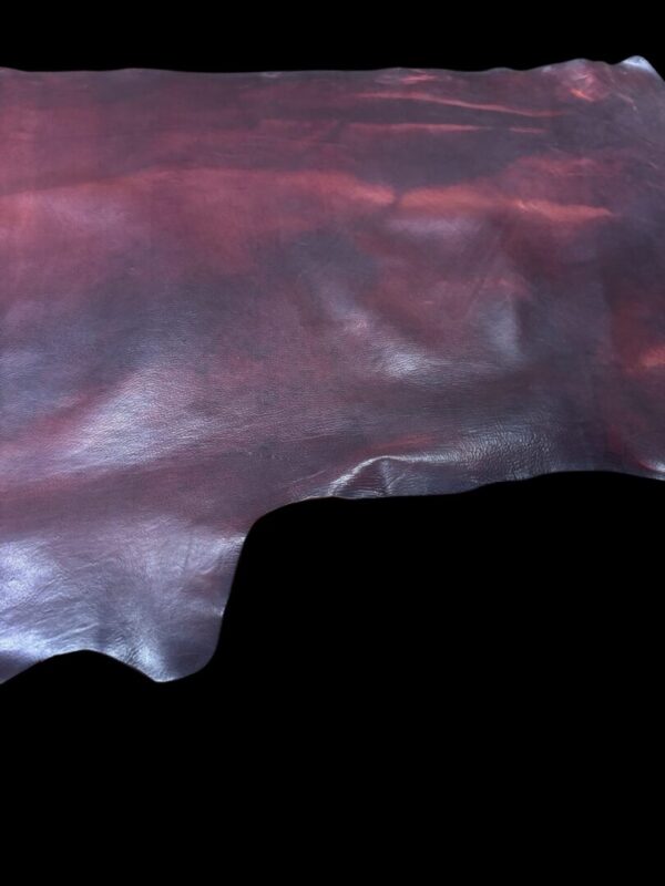 Brown leather hide displayed on black background.