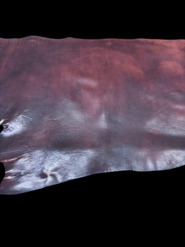 Brown leather hide on black background.