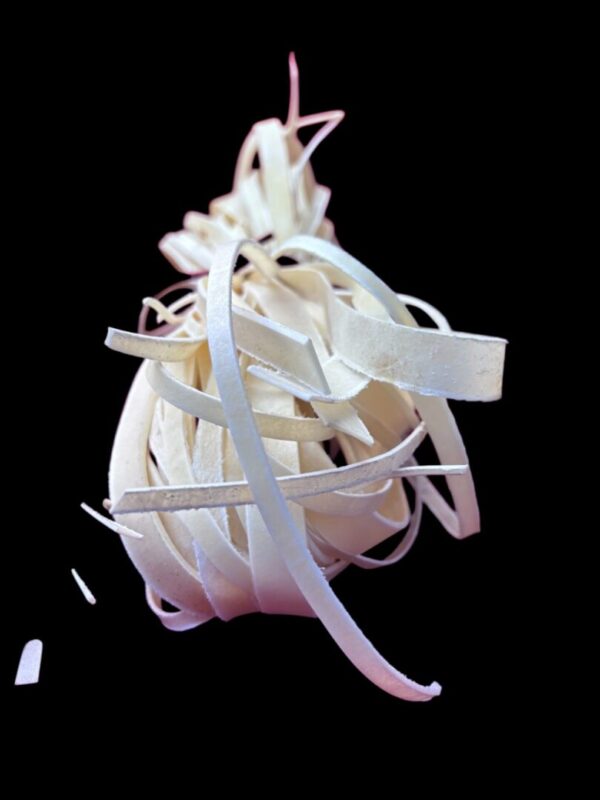 White ribbons tangled against a black background.