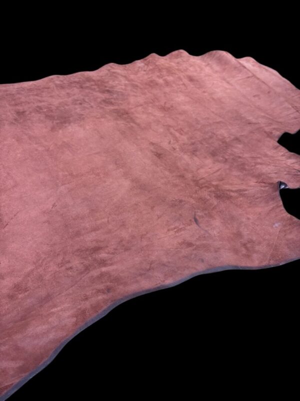 JIMN6021 Pink leather hide on a dark background.