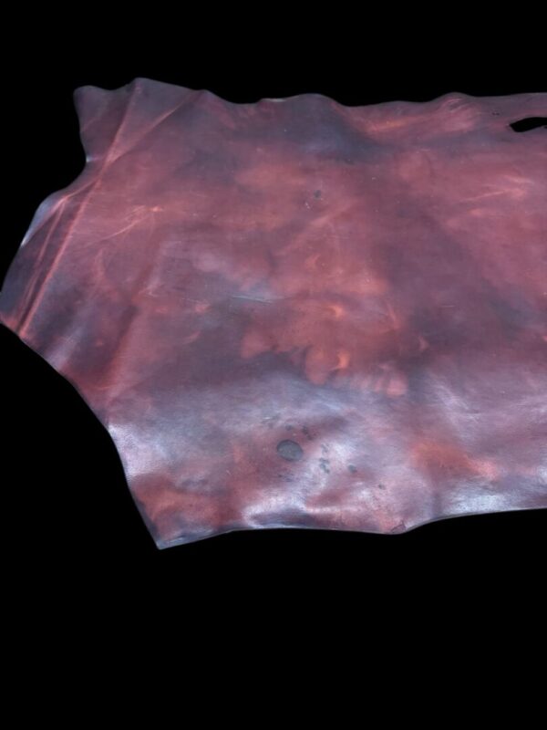 JNTC1814 Brown leather piece on a black background.