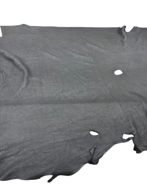 Gray leather hide with holes and imperfections.