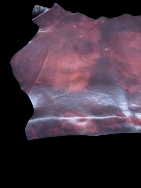 OTZV9770 Textured leather material with reddish tones.