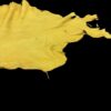 Yellow cloth draped against a black background.