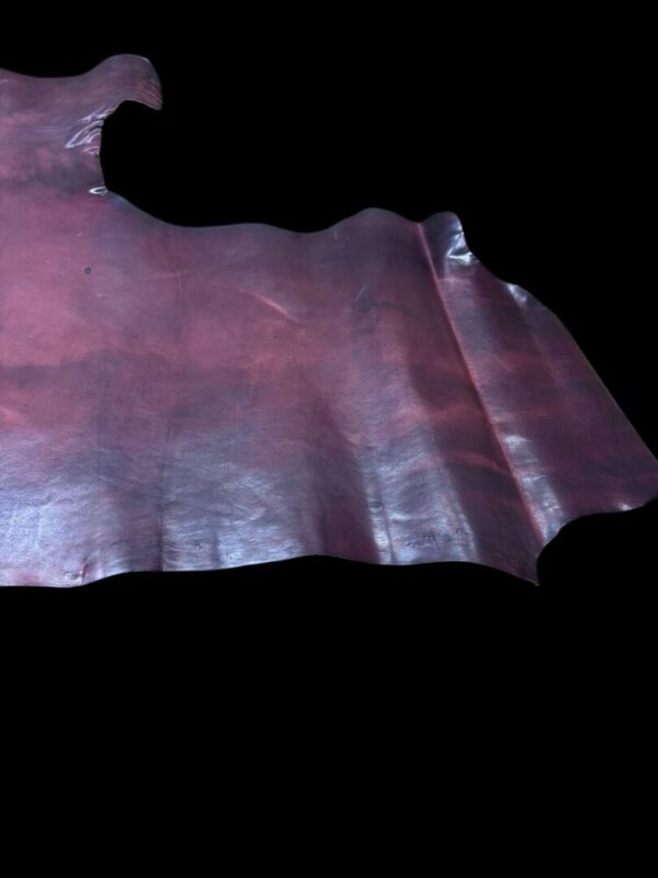 RZXR9724 Brown leather hide against a black background.