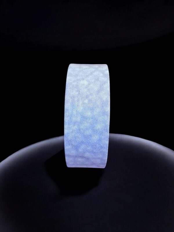 Glowing blue ring on dark background.