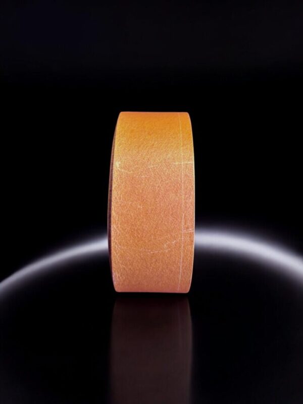 Orange wheel on reflective black surface.