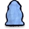 Blue sheepskin rug with black edging and trim.